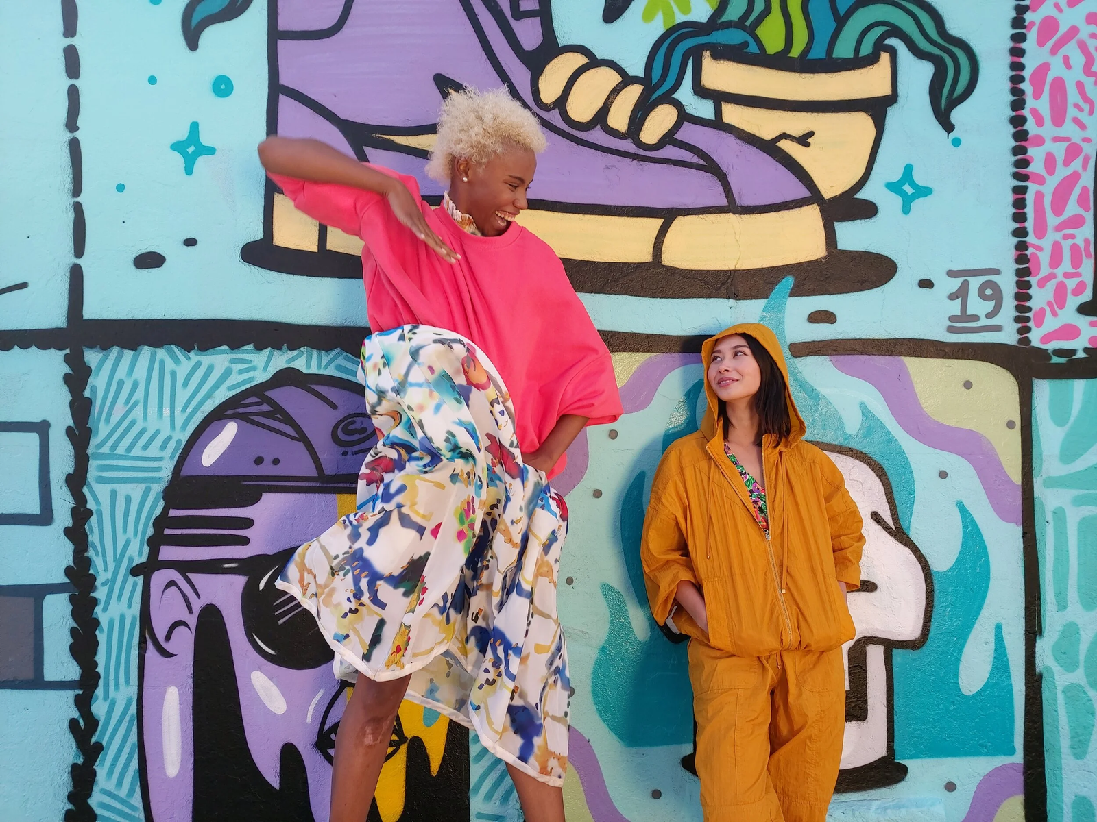 Two models against a mural, shot at 80º wide angle